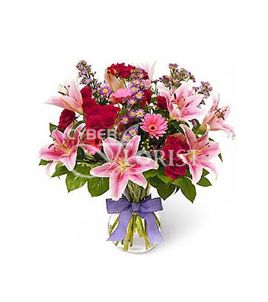 arrangement of lilies roses and gerberas
